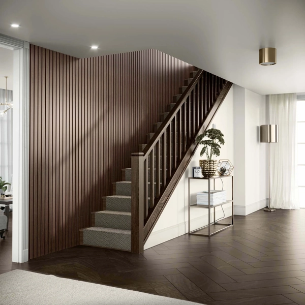 Staircase Walls.webp Vertical walnut wood slat accent wall by a staircase.
