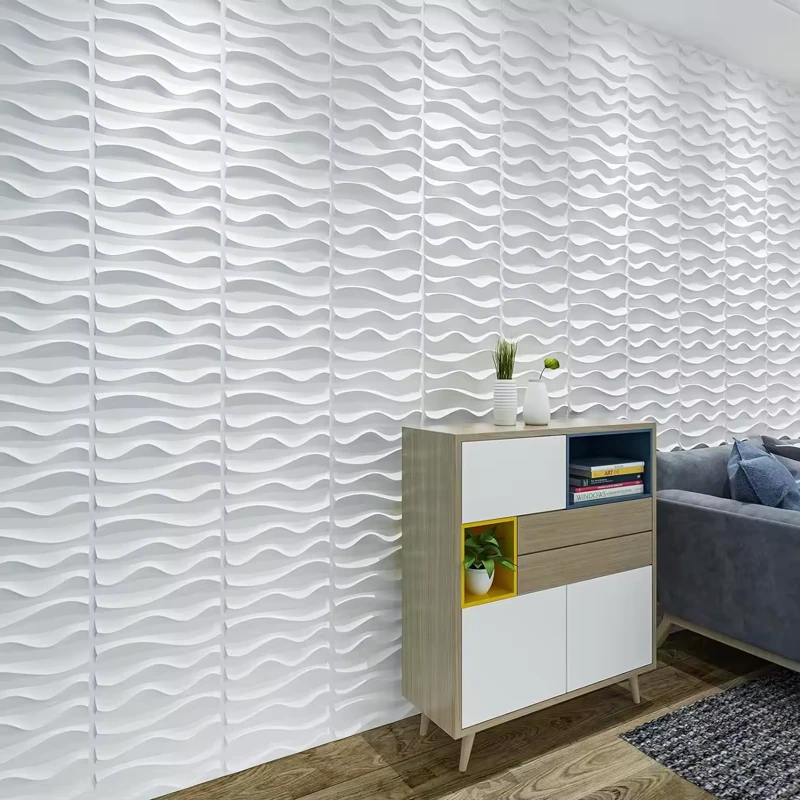 White 3D wave wall panels behind a wooden sideboard