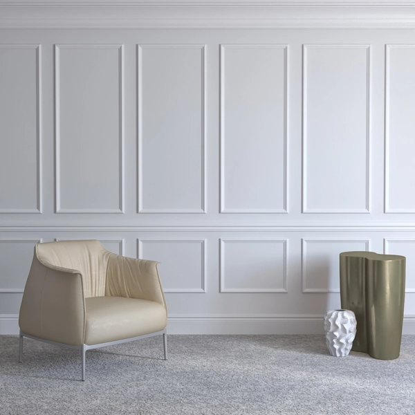 White classic wall paneling with cream armchair